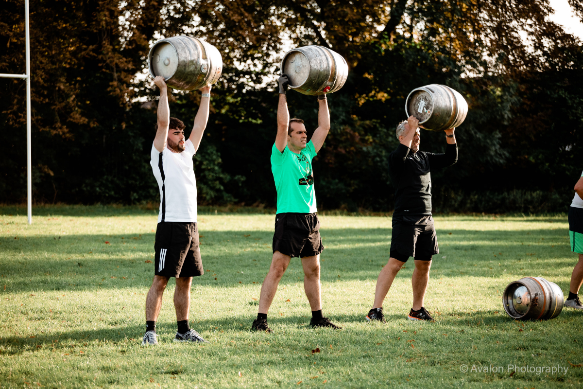 People training with barrel